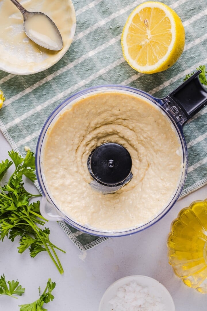 High protein hummus being blended in a food processor.