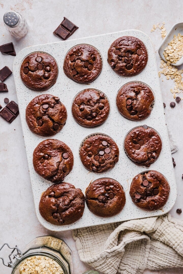 Chocolate cottage cheese muffins baked in a muffin pan.