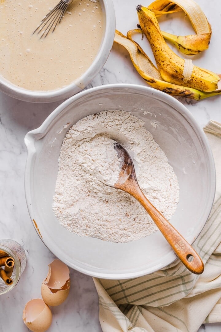 Dry ingredients for cottage cheese banana bread in a white mixing bowl.