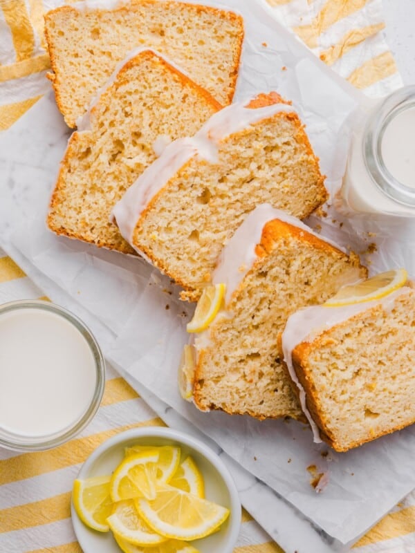 Slices of Starbucks copycat lemon loaf on a marble countertop.