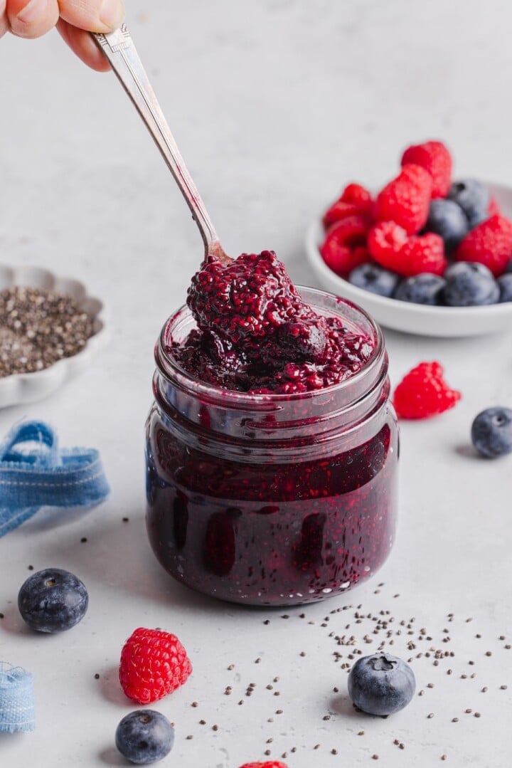 Frozen berry chia jam in a glass jar.