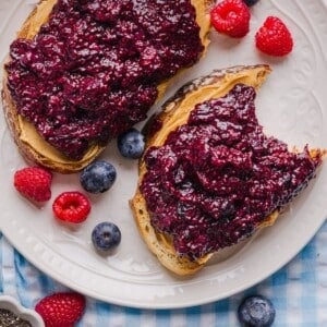 Frozen berry chia jam on two slices of toast with peanut butter.