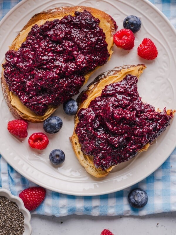 Frozen berry chia jam on two slices of toast with peanut butter.