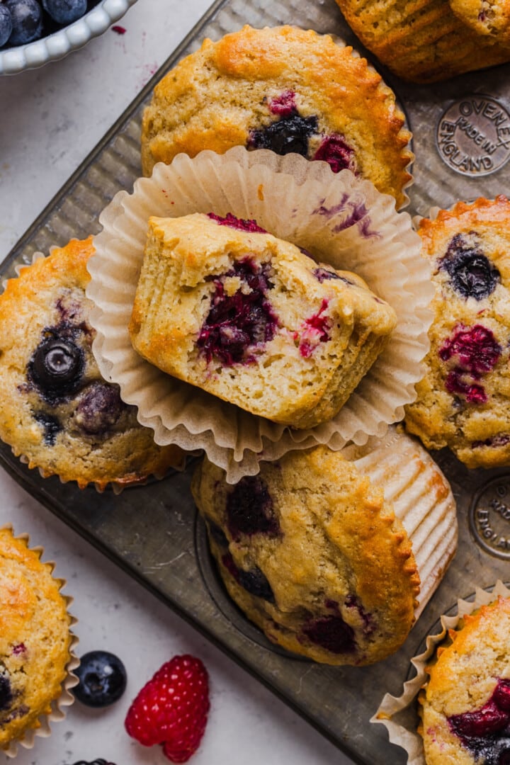 Triple berry protein pancake muffins displayed in a muffin tin.