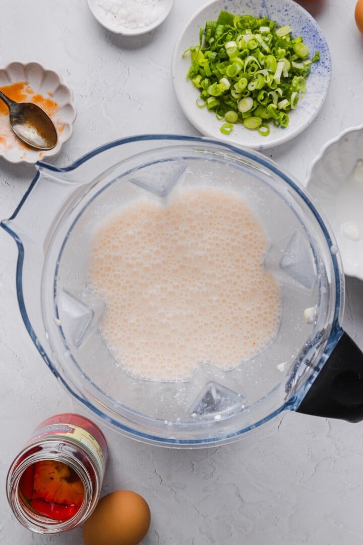The base for egg white bites batter blended in a large blender.