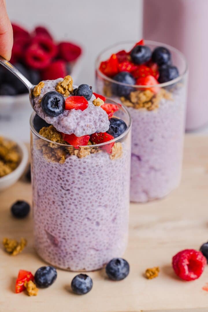 Spoon lifting up kefir chia pudding.
