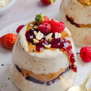 Peanut Butter Jelly Overnight Oats in a glass jar.