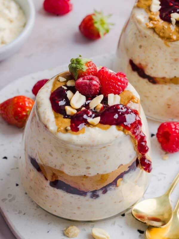 Peanut Butter Jelly Overnight Oats in a glass jar.