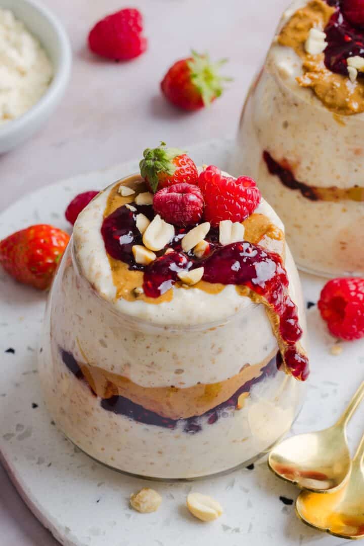 Peanut Butter Jelly Overnight Oats in a glass jar.