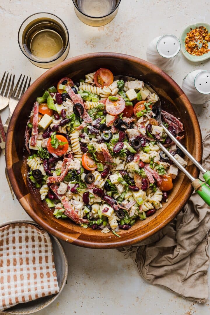 Pizza pasta salad in a large mixing bowl.