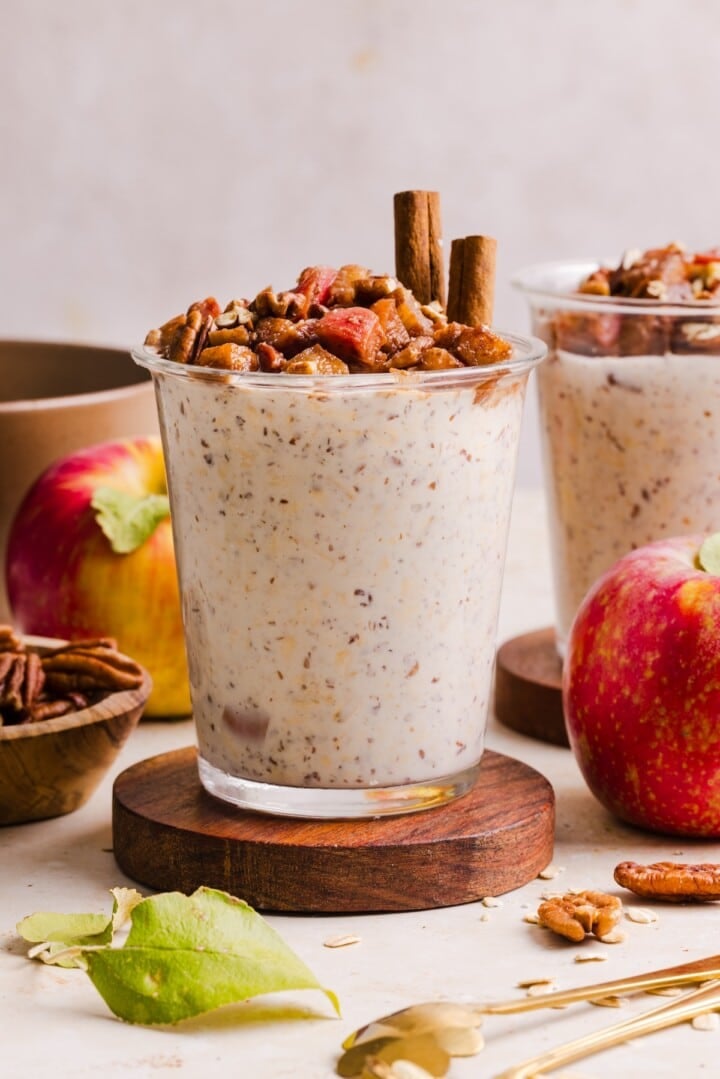 Apple pie overnight oats in a glass jar.