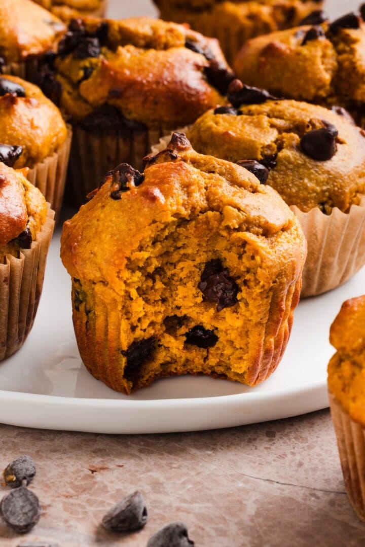 Pumpkin protein muffins on a white plate.