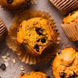 Pumpkin protein muffins on a marble counter.