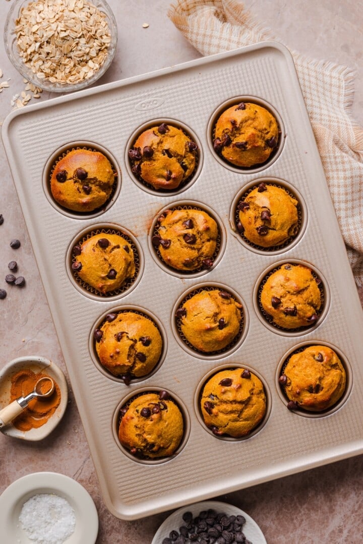 Pumpkin protein muffins baked in a baking pan.
