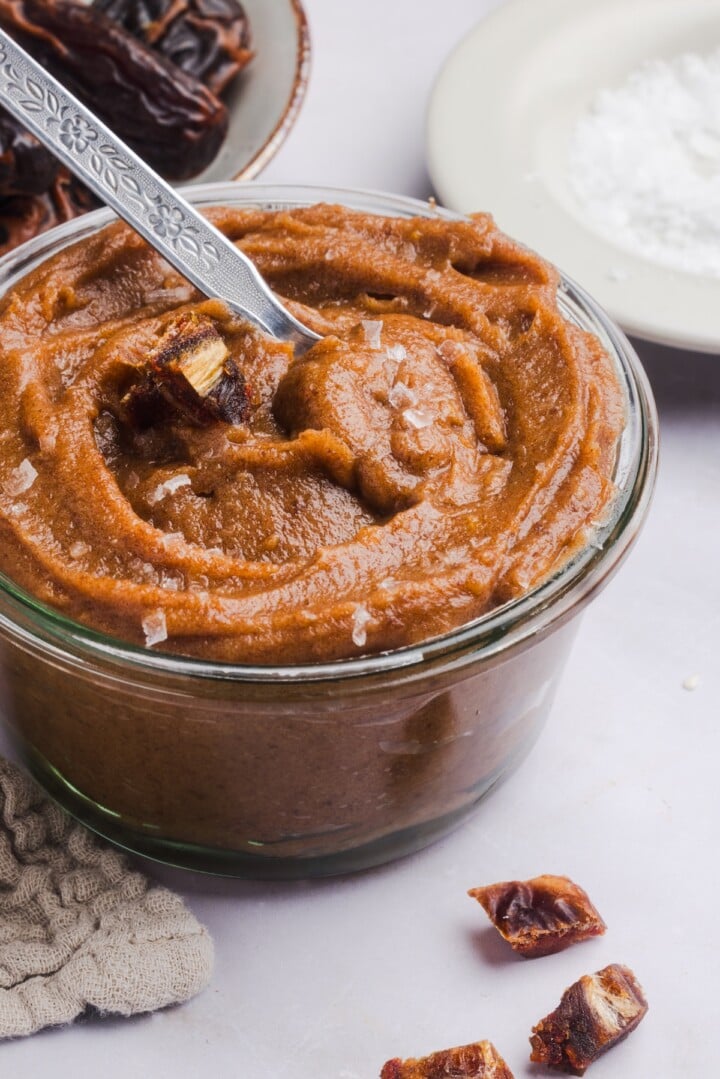 Date caramel in a glass jar.