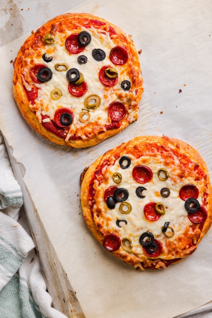 Cottage cheese pizza buns baked on parchment paper.
