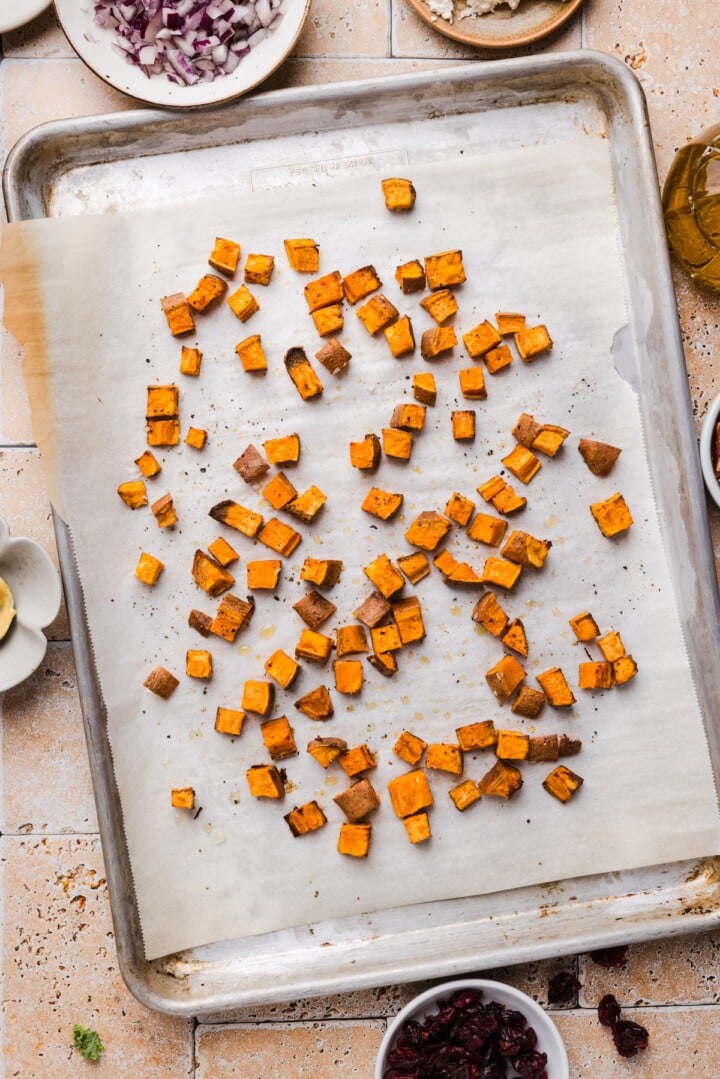 Cubed sweet potato on a baking tray.