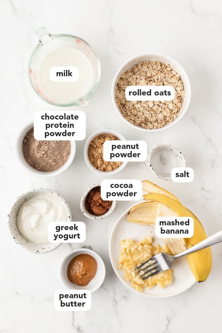 Ingredients for peanut butter overnight oats in small bowls.