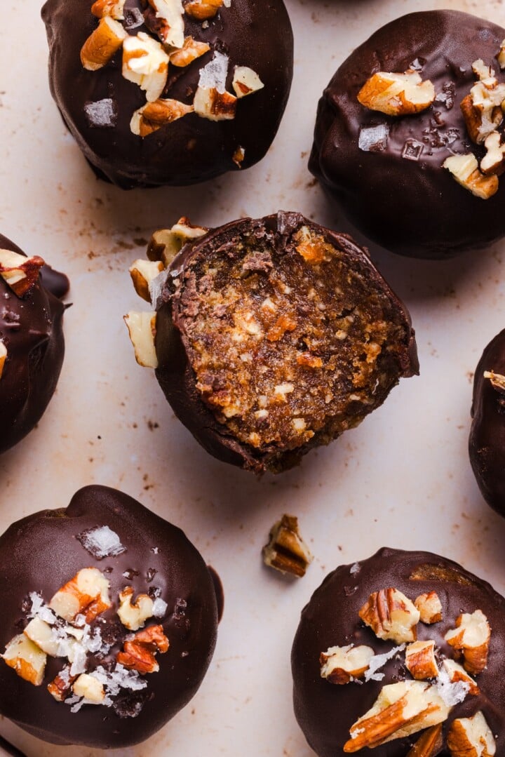 Pecan pie energy bites coated in chocolate.